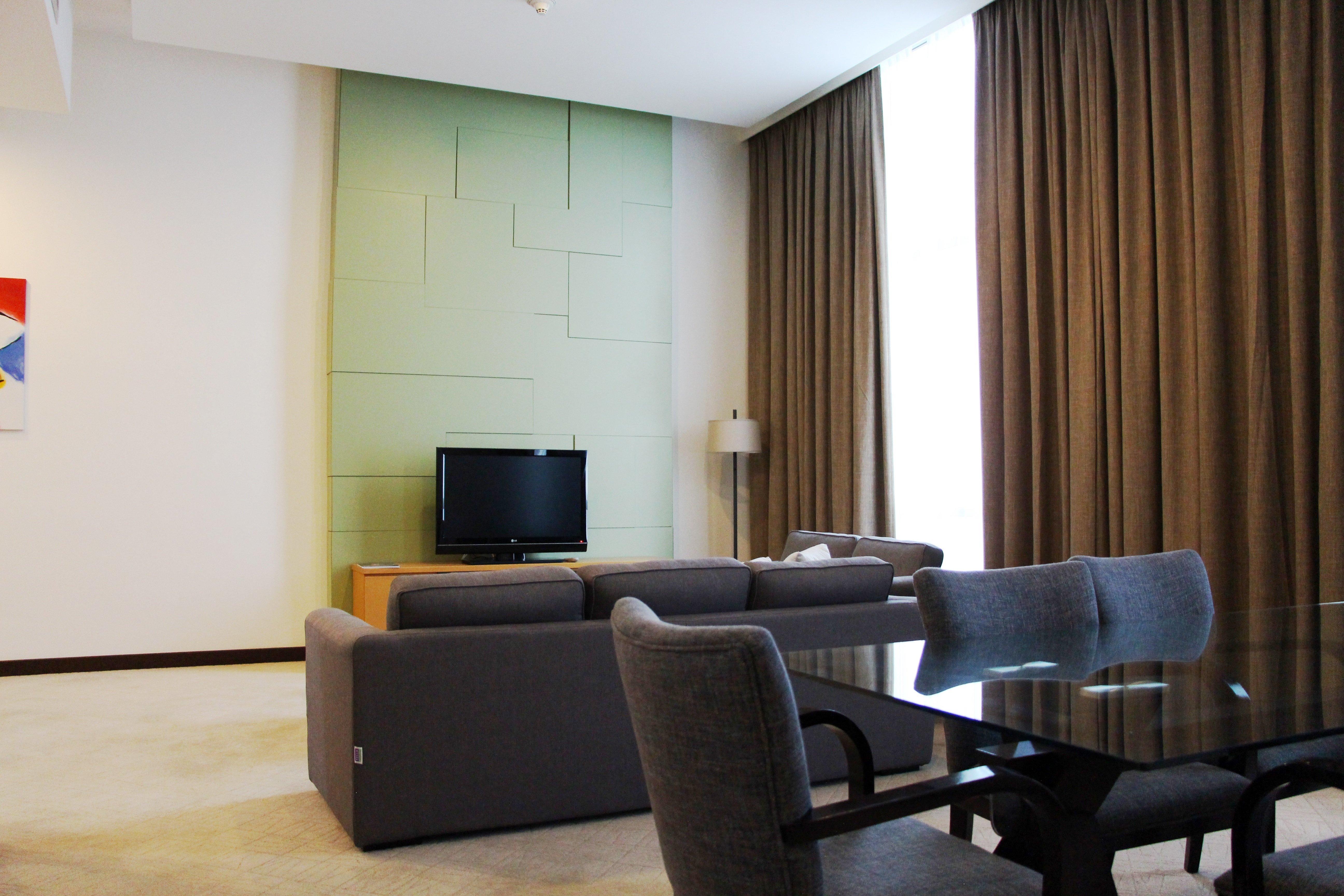 Holiday Inn Melaka By Ihg Eksteriør billede A living room in a hotel suite